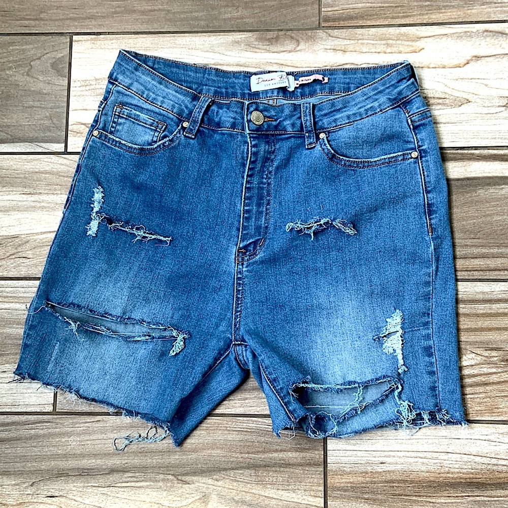 These are Jean shorts that have rips in them. The color is like a lightish blue